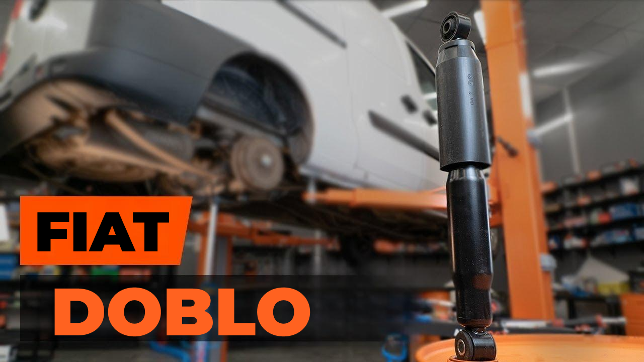 Амортизатор для Fiat Doblo на фоні піднятого автомобіля в автосервісі
